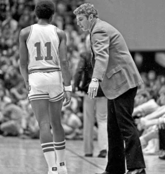 Bob Knight chatting with freshman Isiah Thomas on the sidelines.