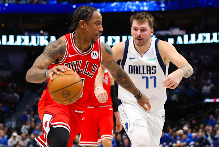 Chicago Bulls forward DeMar DeRozan (11) drives to the basket as Dallas Mavericks guard Luka Doncic (77) defends during the second half at American Airlines Center.