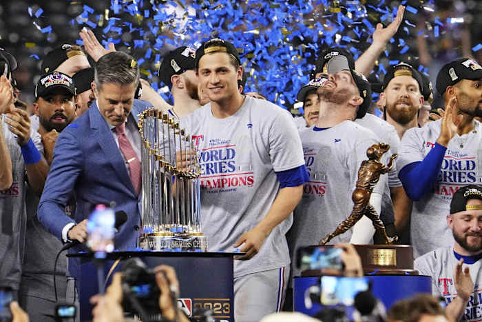Texas Rangers shortstop Corey Seager (5) celebrates with the World Series MVP after the Texas Rangers beat the Arizona Diamondbacks to win the World Series in game five of the 2023 World Series at Chase Field in Phoenix on Nov. 1, 2023.