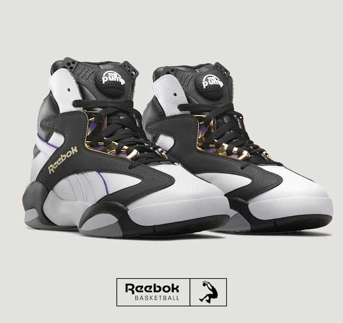 Side view of Shaquille O'Neal's black and white Reebok sneakers.