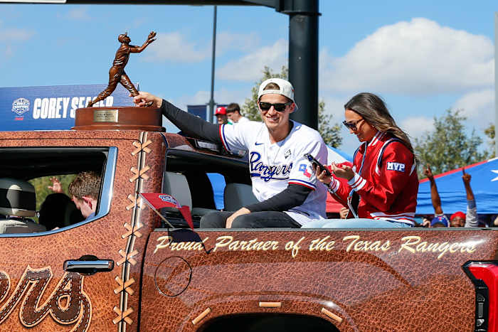 Texas Rangers shortstop Corey Seager holds onto the World Series MVP trophy during the World Series championship parade Friday afternoon at Globe Life Field.