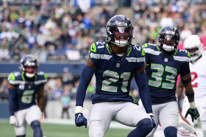 Seattle Seahawks cornerback Devon Witherspoon (21) celebrates after the defense made a play against the Arizona Cardinals during the second half at Lumen Field.