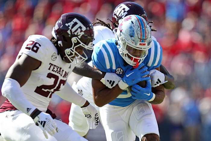 Nov 4, 2023; Oxford, Mississippi, USA; Mississippi Rebels wide receiver Tre Harris (9) runs after a catch against Texas A&M Aggies defensive back Demani Richardson (26) and defensive back Sam McCall (16) during the first half at Vaught-Hemingway Stadium. Mandatory Credit: Petre Thomas-USA TODAY Sports