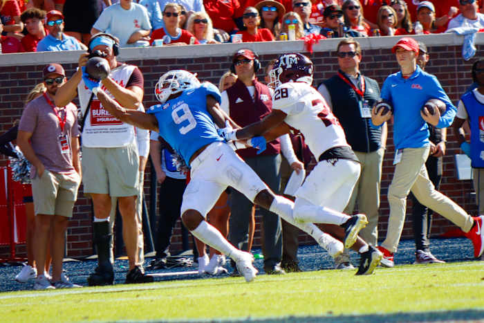 Ole Miss Rebels Tre Harris makes diving grab against Texas A&M defensive back Josh DeBerry at Vaught-Hemingway Stadium in Oxford.