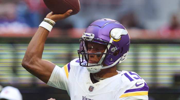 Minnesota Vikings quarterback Joshua Dobbs (15) throws a pass against the Atlanta Falcons in the first half at Mercedes-Benz Stadium.