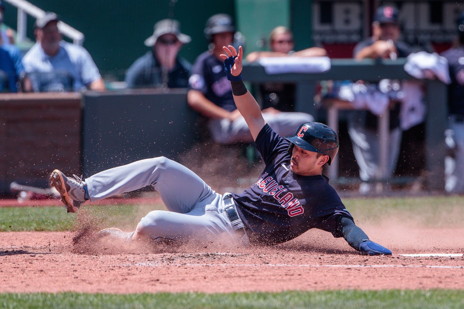 Jun 29, 2023; Kansas City, Missouri, USA; Cleveland Guardians left fielder Steven Kwan (38) slides across home plate during the fifth inning against the Kansas City Royals at Kauffman Stadium. Mandatory Credit: William Purnell-USA TODAY Sports