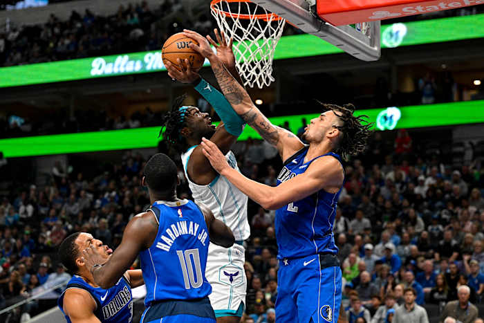 Dallas Mavericks rookie Dereck Lively II contests Charlotte Hornets' Mark Williams, who, like Lively, also played his college ball at Duke.