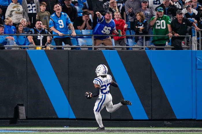 Nov 5, 2023; Charlotte, North Carolina, USA; Indianapolis Colts cornerback Kenny Moore II (23) gets a pick six as fans cheer during the second half against the Carolina Panthers at Bank of America Stadium. Mandatory Credit: Jim Dedmon-USA TODAY Sports