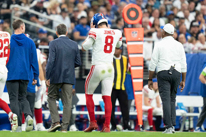 Giants quarterback Daniel Jones walks to the sideline after suffering a torn Achilles against the Raiders during the second quarter Sunday at Allegiant Stadium.