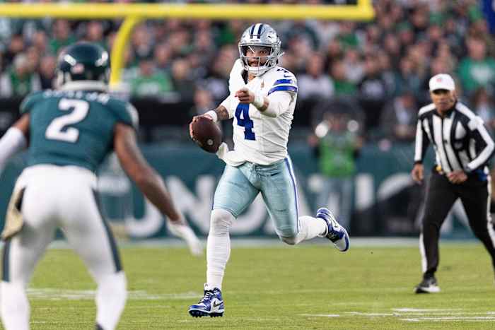 Dallas Cowboys quarterback Dak Prescott runs with the ball against the Philadelphia Eagles.
