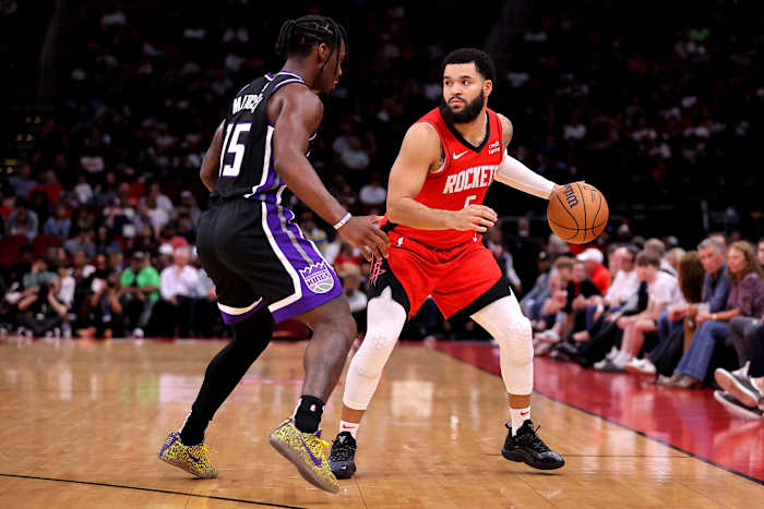 Rockets guard Fred VanVleet handles the ball against Sacramento Kings guard Davion Mitchell (15) during the second quarter at Toyota Center.