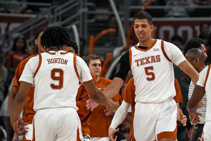 Texas Longhorns forward Kadin Shedrick (5) celebrates with guard Ithiel Horton (9) during a timeout in the men s basketball game against the University of the Incarnate Word at the Moody Center