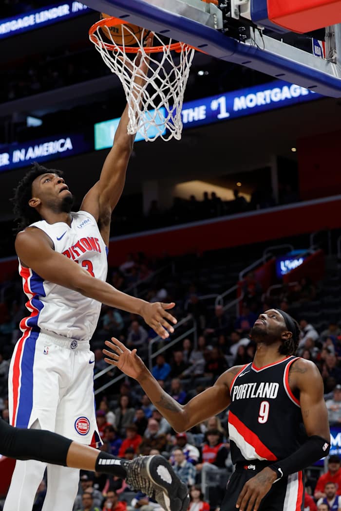 Detroit Pistons center James Wiseman (13) shoots on Portland Trail Blazers forward Jerami Grant (9) in the second half at Little Caesars Arena. Mandatory Credit Rick Osentoski-USA TODAY Sports