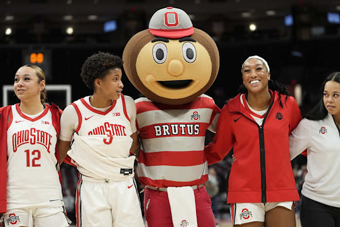 Jan 19, 2023; Columbus, OH, USA; Brutus Buckeye sings Carmen Ohio with arms around guard Hevynne Bristow (3) and forward Cotie McMahon (32) following their 84-54 win over the Northwestern Wildcats in the NCAA women's basketball game at Value City Arena