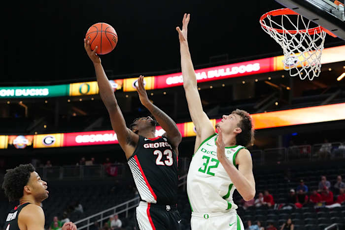Nov 6, 2023; Las Vegas, Nevada, USA; Georgia Bulldogs forward Jalen DeLoach (23) shoots against Oregon Ducks center Nate Bittle (32) during the second half at T-Mobile Arena. Mandatory Credit: Stephen R. Sylvanie-USA TODAY Sports