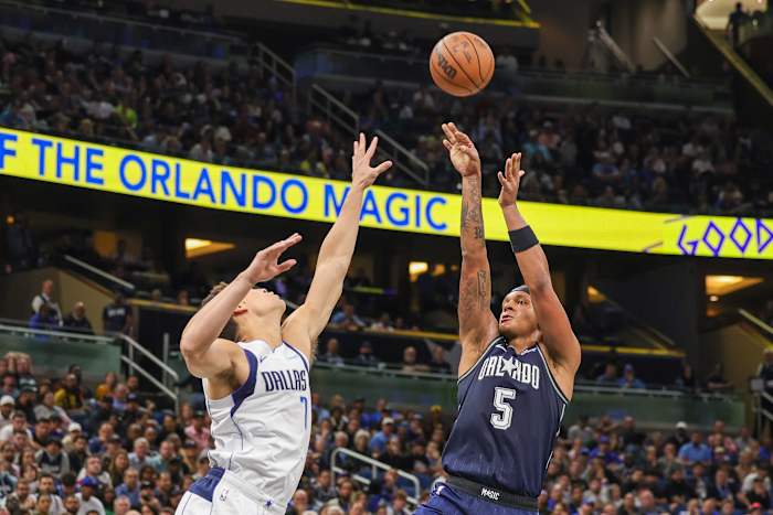 Orlando Magic forward Paolo Banchero (5) shoots the ball against Dallas Mavericks center Dwight Powell (7) during the second half at Amway Center.