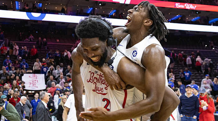 Tyrese Maxey leaps on Joel Embiid to celebrate 76ers’ win vs. Jazz.
