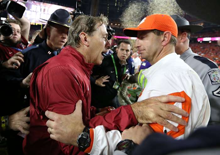 Jan 11, 2016; Glendale, AZ, USA; Clemson Tigers head coach Dabo Swinney congratulates Alabama Crimson Tide head coach Nick Saban following the 45-40 victory in the 2016 CFP National Championship at University of Phoenix Stadium.