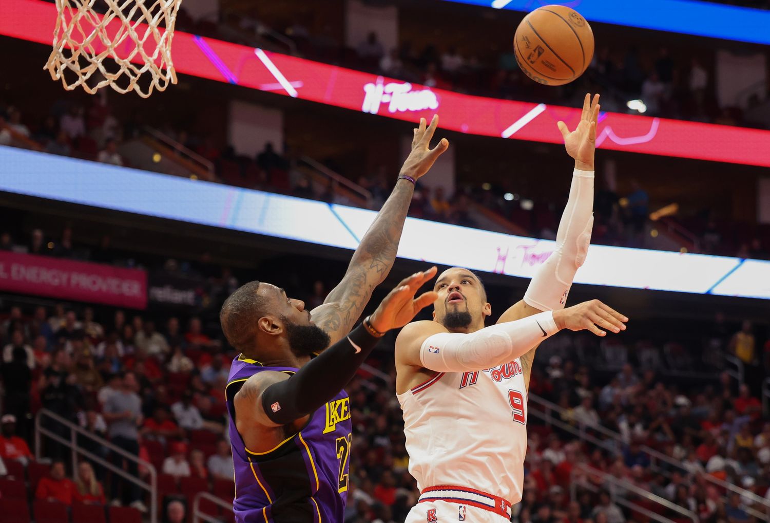 Houston Rockets forward Dillon Brooks (9) puts up a hook shot over Los Angeles Lakers forward LeBron James (23)
