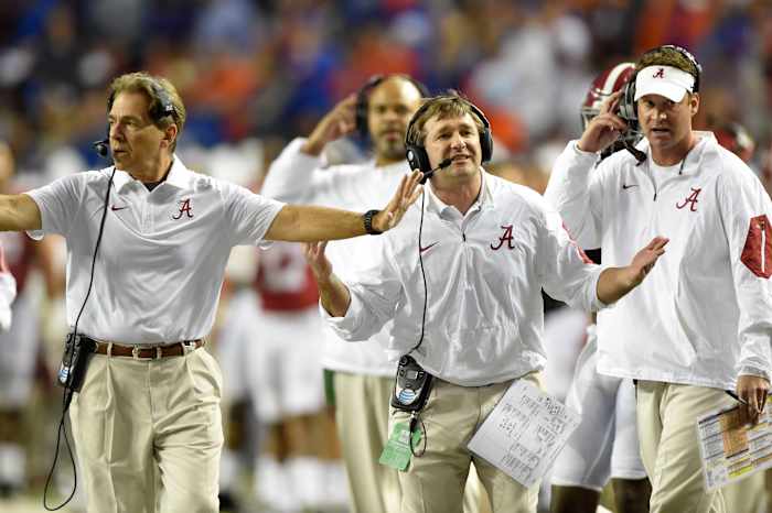 Alabama Crimson Tide head coach Nick Saban (left), defensive coordinator Kirby Smart (center), and offensive coordinator Lane Kiffin (right) react during the second quarter of the 2015 SEC Championship Game.