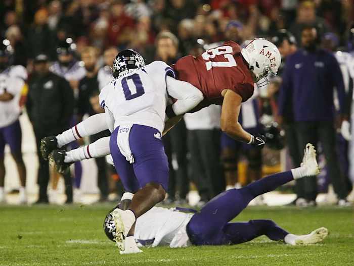 Iowa State Cyclones tight end Easton Dean (87) drives for a first down around TCU Horned Frogs safety Abe Camara (1) and linebacker Shad Banks Jr. (0)during the third quarter in the Jack Trice Legacy Game at Jack Trice Stadium on Saturday, Oct. 7, 2023, in Ames, Iowa.