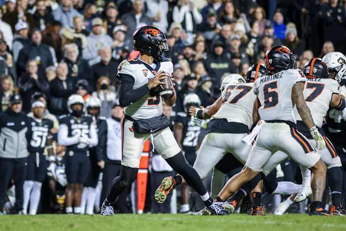 Nov 4, 2023; Boulder, Colorado, USA; Oregon State Beavers quarterback DJ Uiagalelei (5) drops back for a pass against the Colorado Buffaloes at Folsom Field. Mandatory Credit: Chet Strange-USA TODAY Sports