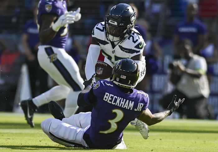 Seattle Seahawks cornerback Riq Woolen (27) breaks up a pass intended for Baltimore Ravens wide receiver Odell Beckham Jr. (3) during the first half at M&T Bank Stadium.