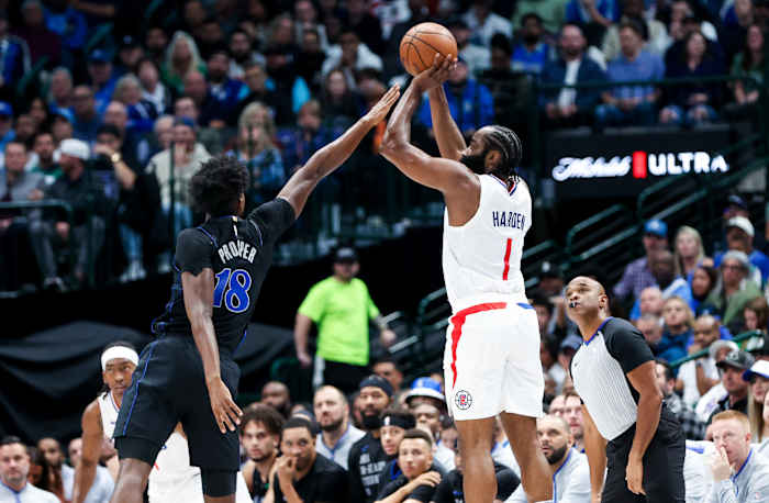Dallas Mavericks rookie Olivier-Maxence Prosper attempts to block Los Angeles Clippers star James Harden.