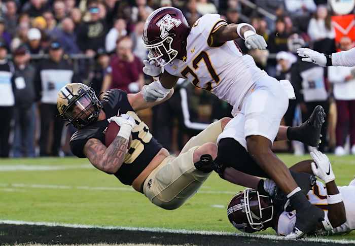 Nov 11, 2023; West Lafayette, Indiana, USA; Purdue Boilermakers tight end Garrett Miller (88) runs a catch in for a touchdown against Minnesota Golden Gophers defensive back Tyler Nubin (27) during the first half at Ross-Ade Stadium.