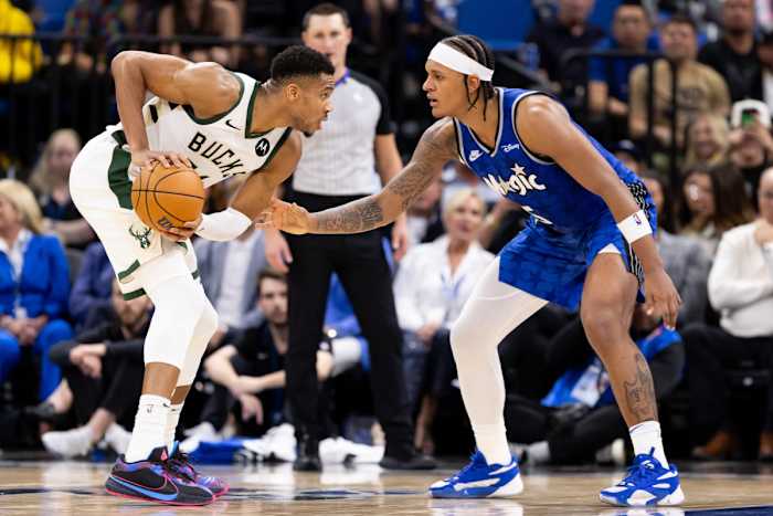 Milwaukee Bucks forward Giannis Antetokounmpo (34) stares at Orlando Magic forward Paolo Banchero (5) during the first half at Amway Center.