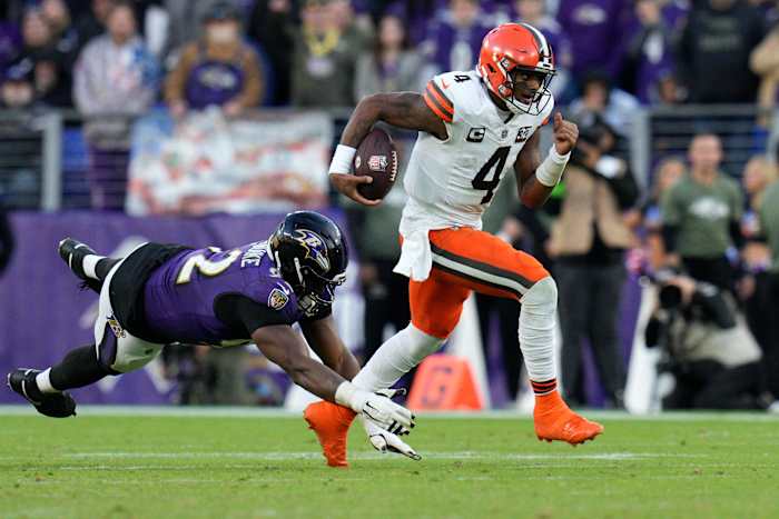 Nov 12, 2023; Baltimore, Maryland, USA; Cleveland Browns quarterback Deshaun Watson (4) runs with the ball as Baltimore Ravens defensive tackle Justin Madubuike (92) defends during the second half at M&T Bank Stadium. Mandatory Credit: Jessica Rapfogel-USA TODAY Sports