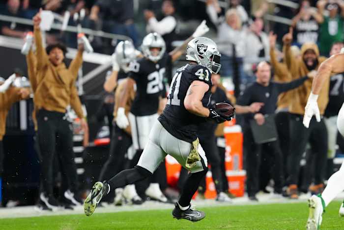 Las Vegas Raiders linebacker Robert Spillane runs with the ball after intercepting a Zach Wilson pass to wrap up a win over the New York Jets at Allegiant Stadium.