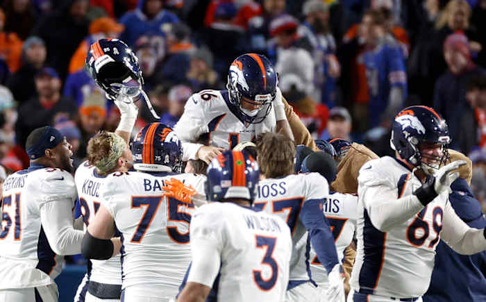 Denver Broncos place kicker Wil Lutz (16) is hoisted on his teammates shoulders after kicking the game winning field goal for a 24-22 win over the Bills.