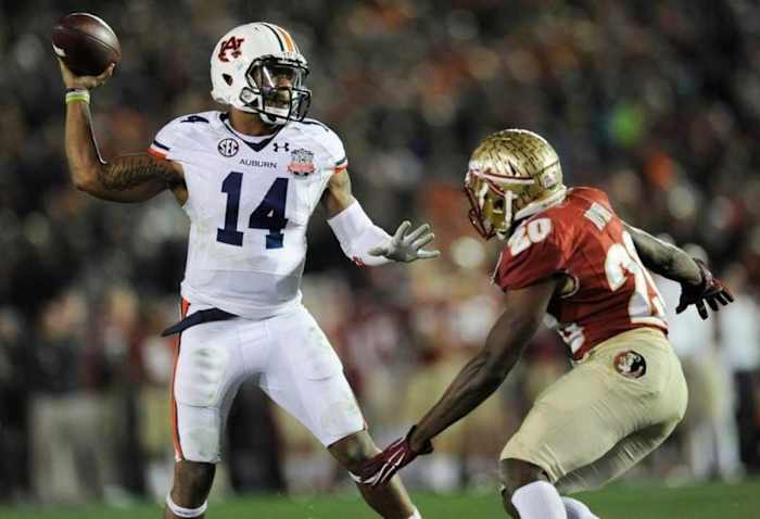 Auburn quarterback Nick Marshall (14) gets a pass away while defended by Florida State defensive back Lamarcus Joyner (20) in second half action of the BCS National Championship Game on Monday January 6, 2014 in Pasadena, Ca.