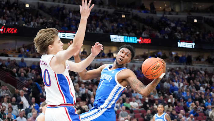 Nov 14, 2023; Chicago, Illinois, USA; Kansas Jayhawks guard Johnny Furphy (10) defends Kentucky Wildcats guard Justin Edwards (1) during the first half at United Center. Mandatory Credit: David Banks-USA TODAY Sports