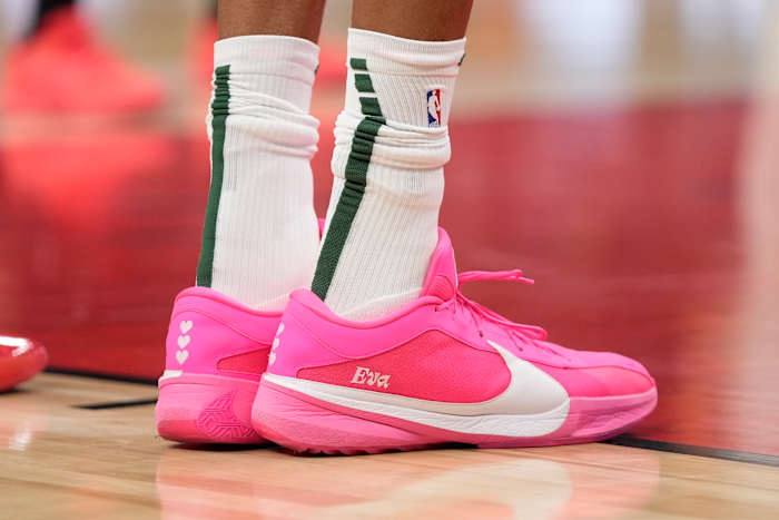 Milwaukee Bucks forward Giannis Antetokounmpo's pink and white Nike sneakers.