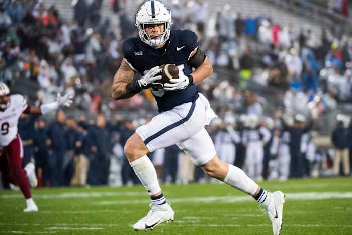 Penn State tight end Theo Johnson scores a touchdown in the Nittany Lions' game against UMass at Beaver Stadium.