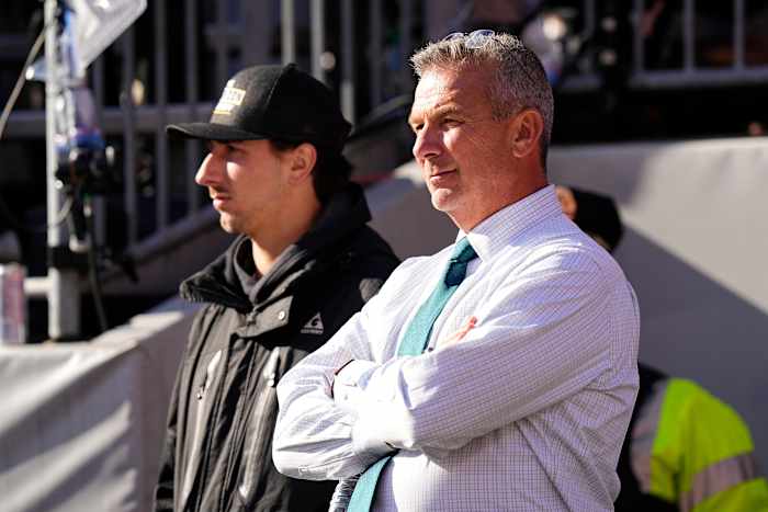 Former Ohio State Buckeyes head coach Urban Meyer watches from the sideline during the first half of the NCAA football game between the Buckeyes and the Michigan Wolverines at Ohio Stadium.