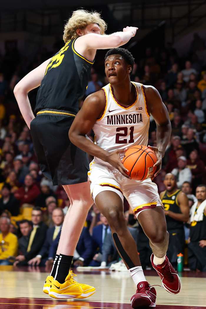 Minnesota Golden Gophers forward Pharrel Payne (21) drives as Missouri Tigers center Connor Vanover (75) defends during the first half at Williams Arena.=