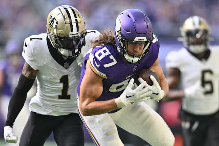 Nov 12, 2023; Minneapolis, Minnesota, USA; Minnesota Vikings tight end T.J. Hockenson (87) is pursued by New Orleans Saints cornerback Alontae Taylor (1) during the second quarter at U.S. Bank Stadium.