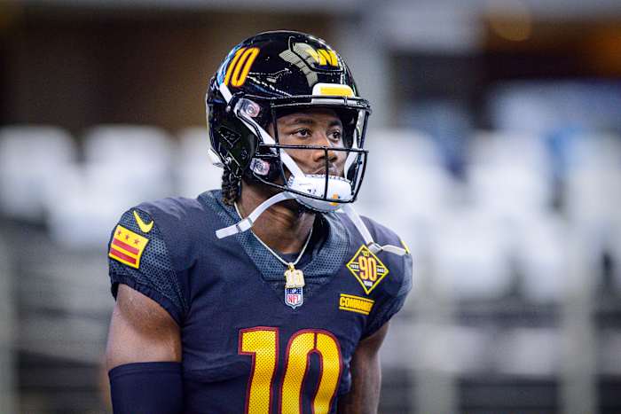Receiver Curtis Samuel models the Washington Commanders black alternate uniforms.