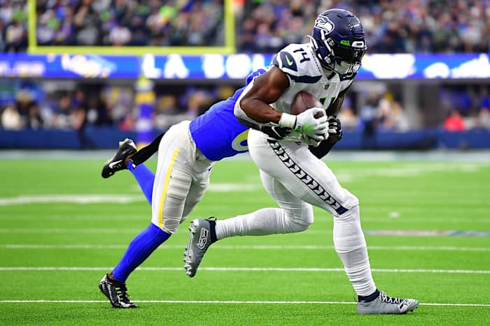 Seattle Seahawks wide receiver DK Metcalf (14) runs the ball against Los Angeles Rams cornerback Derion Kendrick (6) during the second half at SoFi Stadium.