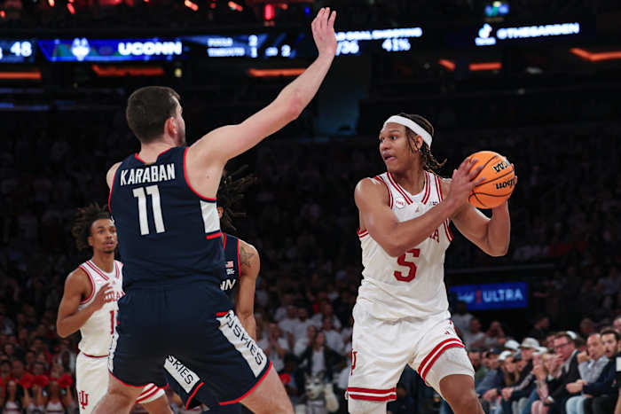 Indiana Hoosiers forward Malik Reneau (5) looks to pass as Connecticut Huskies forward Alex Karaban (11) defends during the second half at Madison Square Garden.