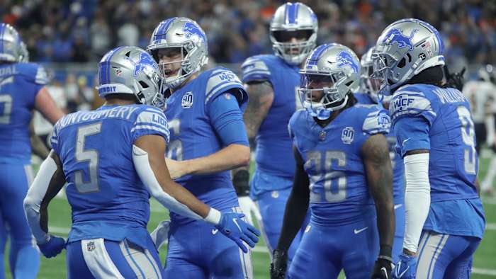 Lions players celebrate after a touchdown