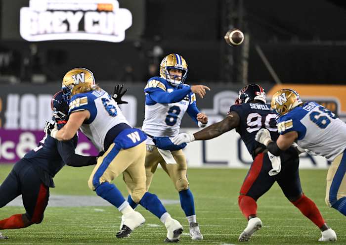 Nov 19, 2023; Hamilton, Ontario, CAN; Winnipeg Blue Bombers quarterback Zach Collaros (8) throws a pass against the Montreal Alouettes in the first half at Tim Hortons Field. Mandatory Credit: Dan Hamilton-USA TODAY Sports