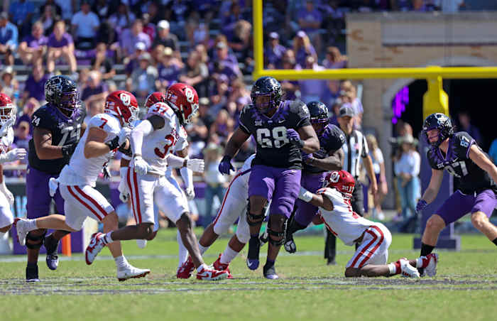 Oct 1, 2022; Fort Worth, Texas, USA; Oklahoma Sooners defensive back Damond Harmon (17) injures himself as TCU Horned Frogs running back Emani Bailey (9) runs with the ball during the second half at Amon G. Carter Stadium. Mandatory Credit: Kevin Jairaj-USA TODAY Sports