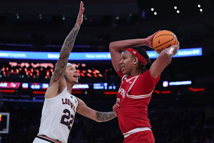 Indiana Hoosiers forward Malik Reneau (5) is guarded by Louisville Cardinals guard Tre White (22) during the second half at Madison Square Garden.