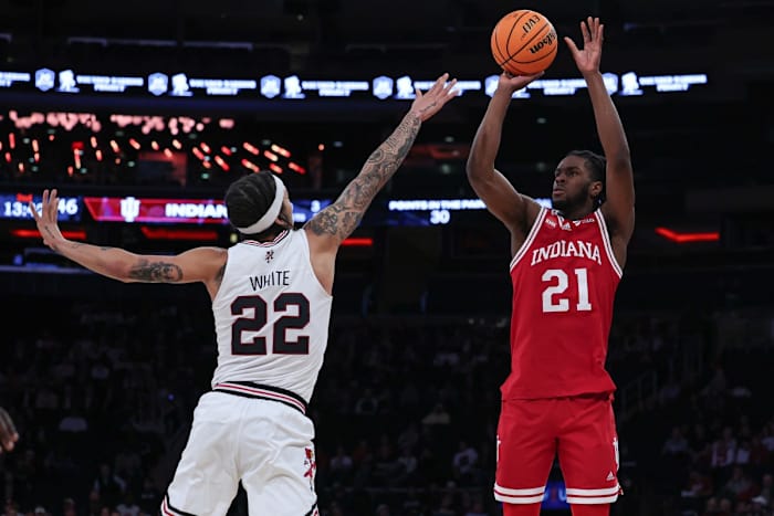Indiana Hoosiers forward Mackenzie Mgbako (21) shoots the ball as Louisville Cardinals guard Tre White (22) defends during the second half at Madison Square Garden.