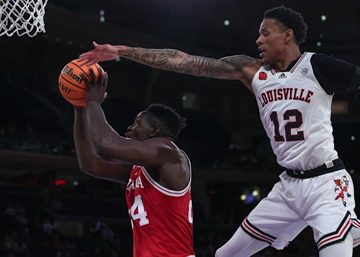 Indiana Hoosiers forward Payton Sparks (24) drives to the basket as Louisville Cardinals forward JJ Traynor (12) defends during the second half at Madison Square Garden.
