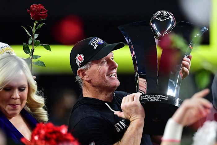 December 3, 2021; Las Vegas, NV, USA; Utah Utes head coach Kyle Whittingham raises the championship trophy following the victory against the Oregon Ducks in the 2021 Pac-12 Championship Game at Allegiant Stadium. Mandatory Credit: Gary A. Vasquez-USA TODAY Sports